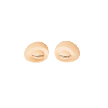 Interchangeable eyes with eyelashes for training head