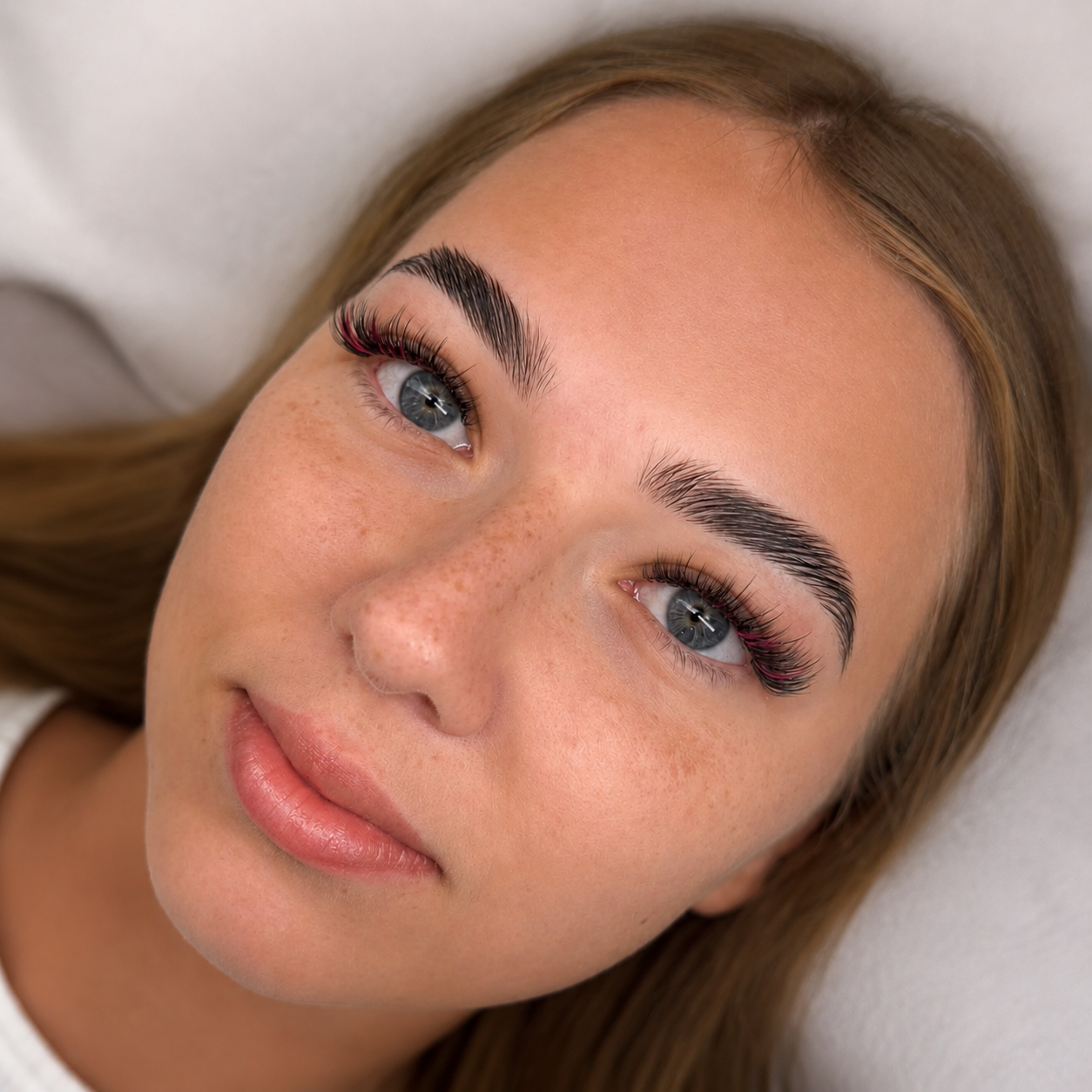 Pink colored lash styling